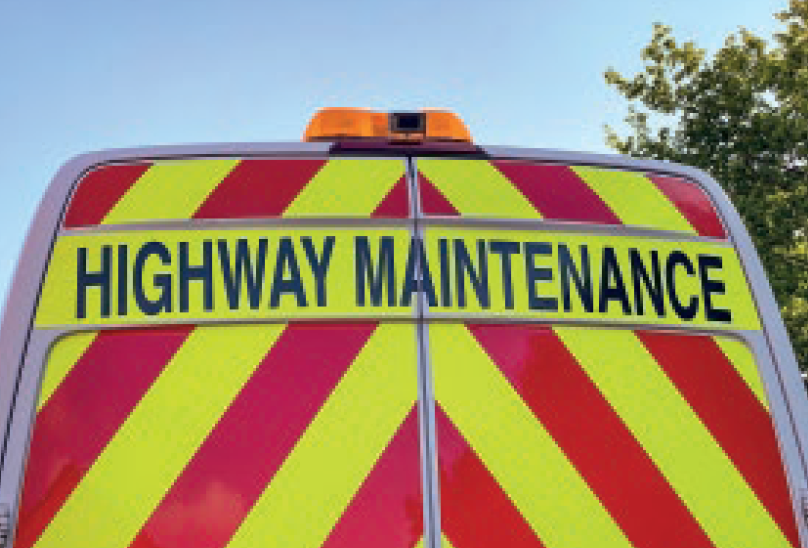 Chapter 8 chevron livery on the rear of a highway maintenance van